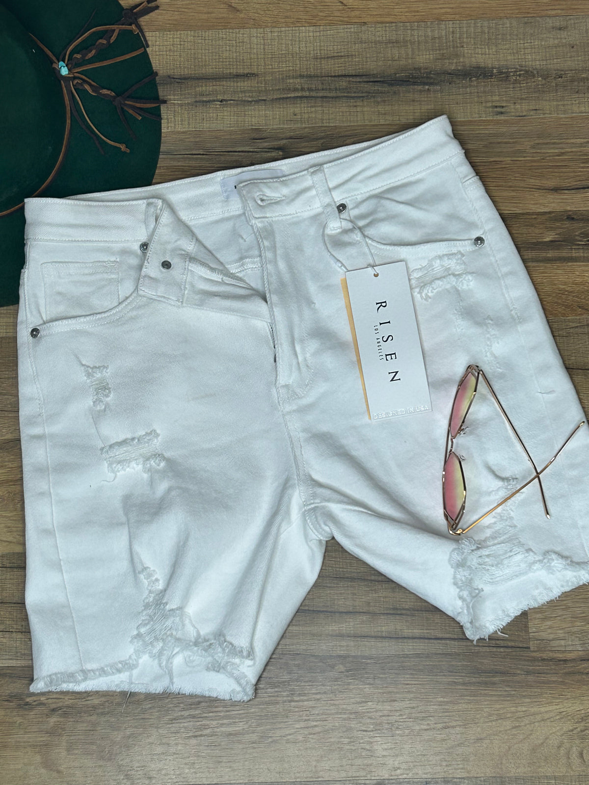 Flat Lay. Risen High Rise White Mid Thigh Shorts-29eleven | Women’s Fashion Boutique in Menan, Idaho