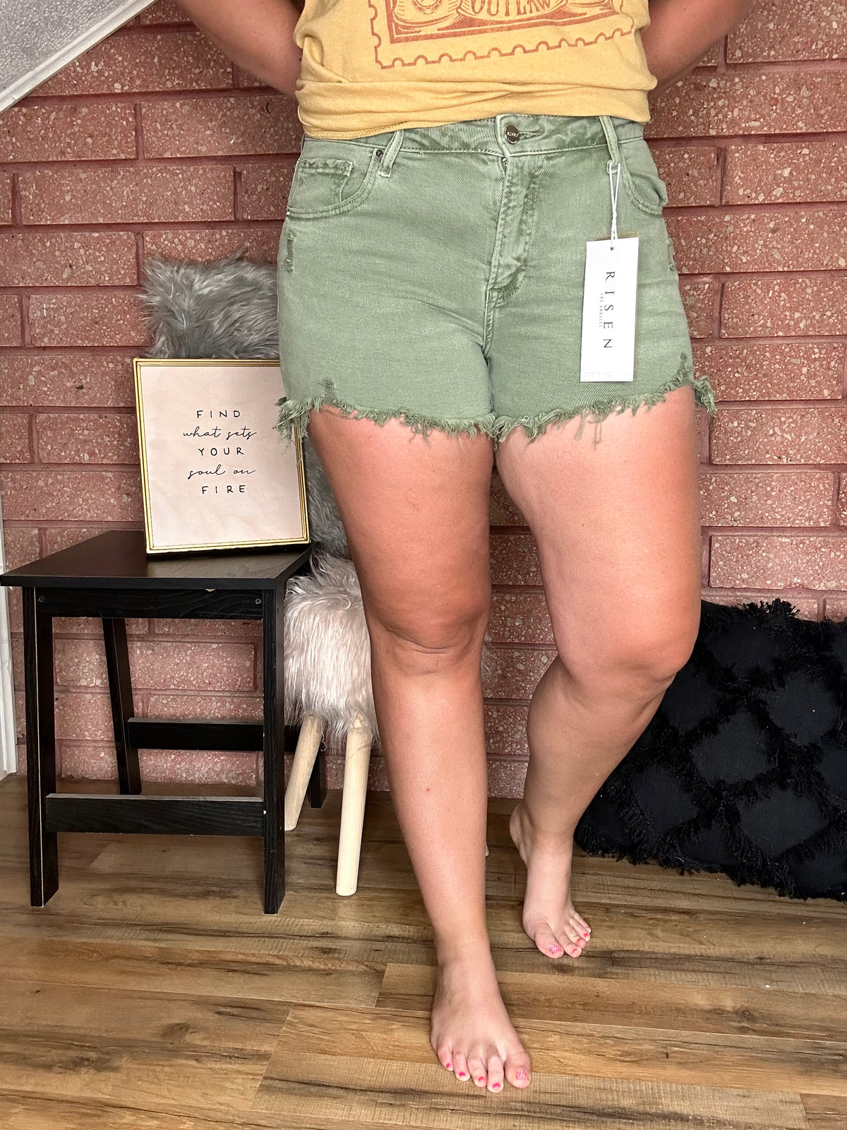 Front View. Risen Mid Rise Distressed Olive Shorts-29eleven | Women’s Fashion Boutique in Menan, Idaho